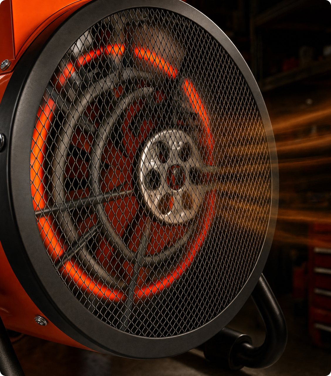 Close-up of the glowing heating coils behind the fan grille